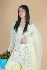 Light yellow sharara suit with embroidery work. It has a plain sharara and net dupatta. 