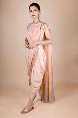 Peach dhoti saree in indowestern style. It has beautiful sequins embroidery work.