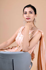 Peach dhoti saree in indowestern style. It has beautiful sequins embroidery work.