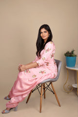 Pink chinon silk patiala salwar kameez with a plain georgette dupatta. The kameez has work on the front and back.